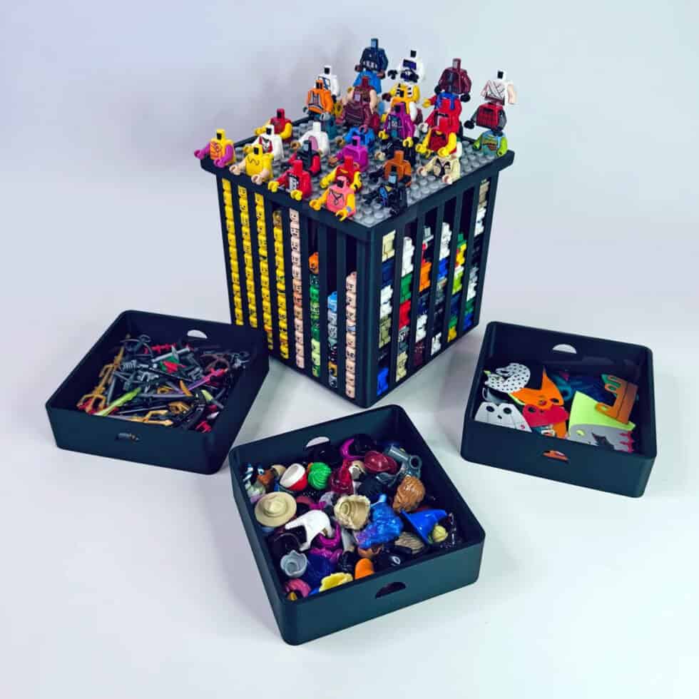 Black LEGO minifigure organizer by FigFix, shown with lid open, trays removed