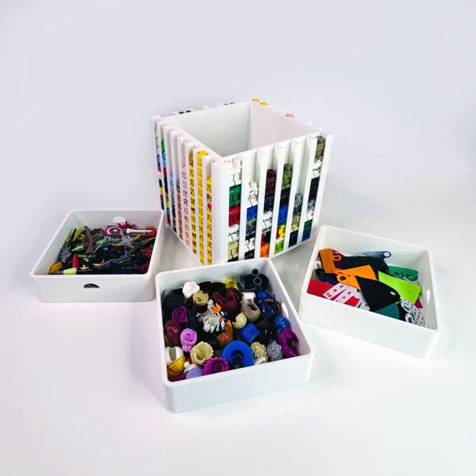 White LEGO minifigure organizer by FigFix, shown with lid open, trays removed