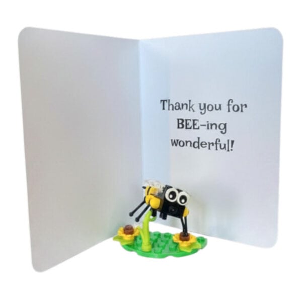 Interior of the bee greeting card showing message area with completed mini LEGO bee build