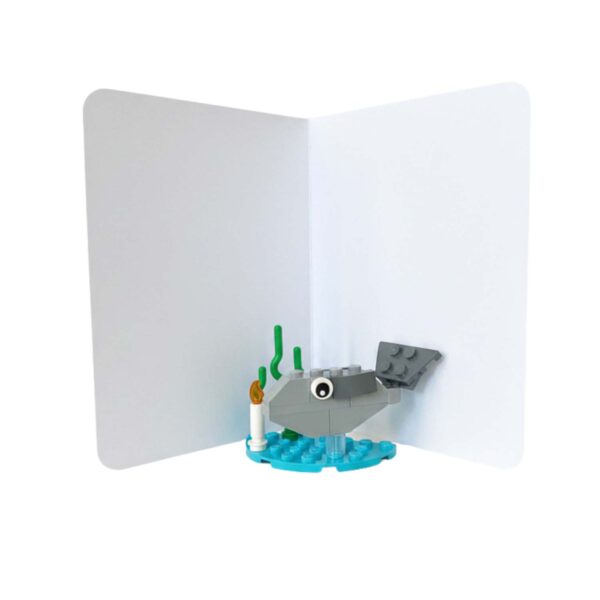 Interior of the fish birthday card showing message area with completed mini LEGO fish build