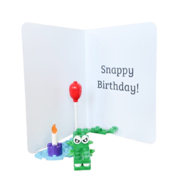 Interior of the crocodile birthday card showing message area with completed mini LEGO crocodile build